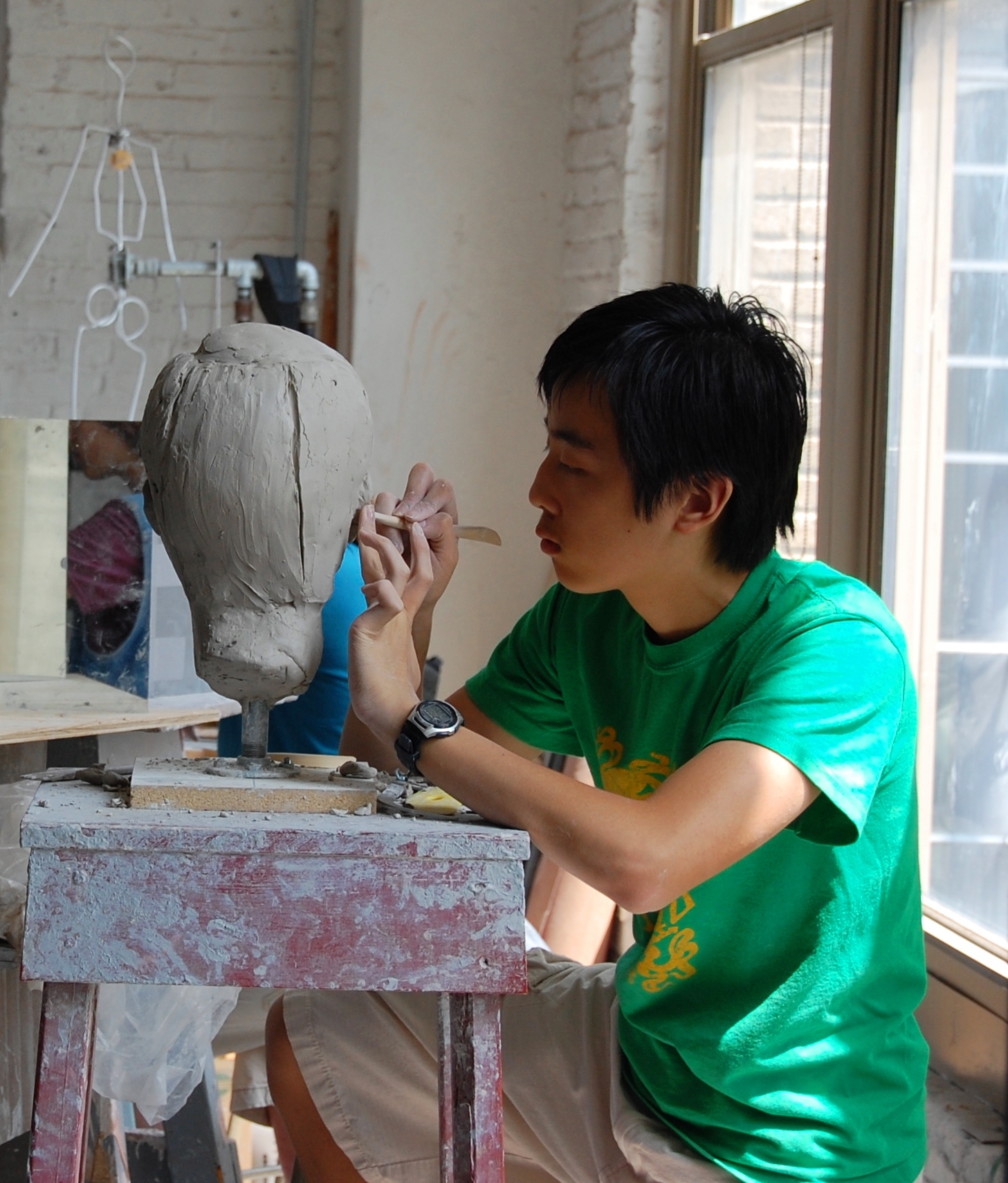 student sculpting