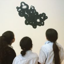 school-children  looking at an artwork