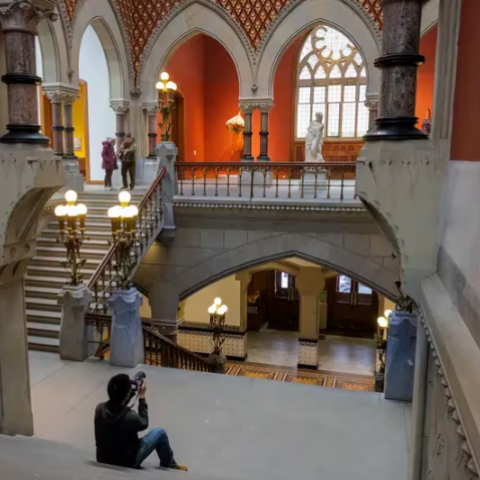 Photographer taking photos of PAFA from the Grand staircase.