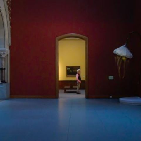 Image of a person standing in a gallery