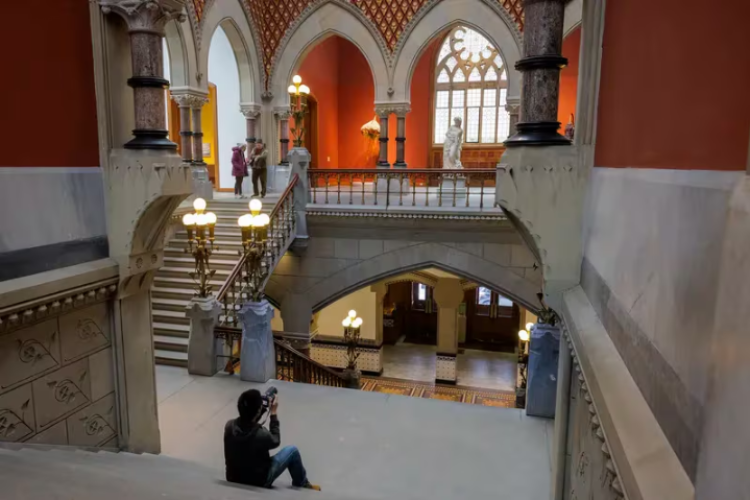 Photographer taking photos of PAFA from the Grand staircase.